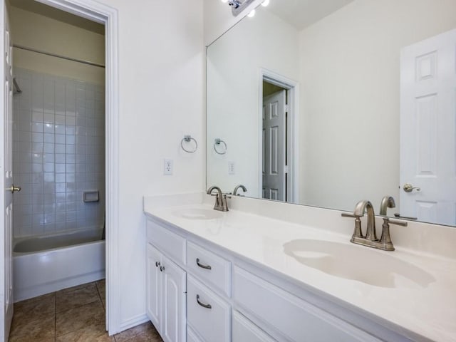 2302 Creek Crossing Dr, Corinth, TX 76210 - full bathroom with double vanity, tile patterned flooring, and  shower combination