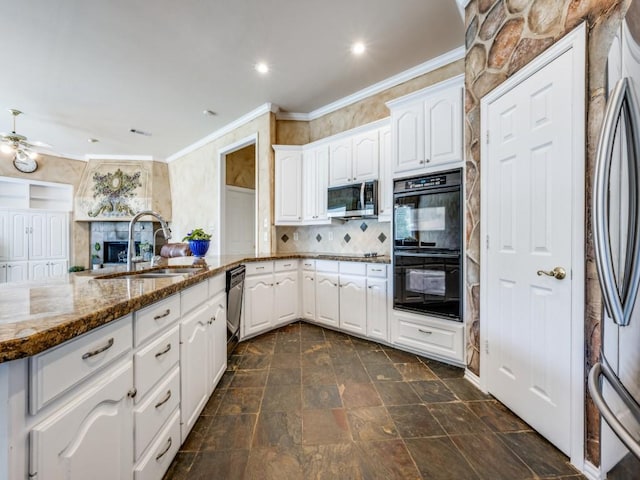 2302 Creek Crossing Dr, Corinth, TX 76210 - kitchen featuring black appliances, a sink, dark stone counters, crown molding, and backsplash