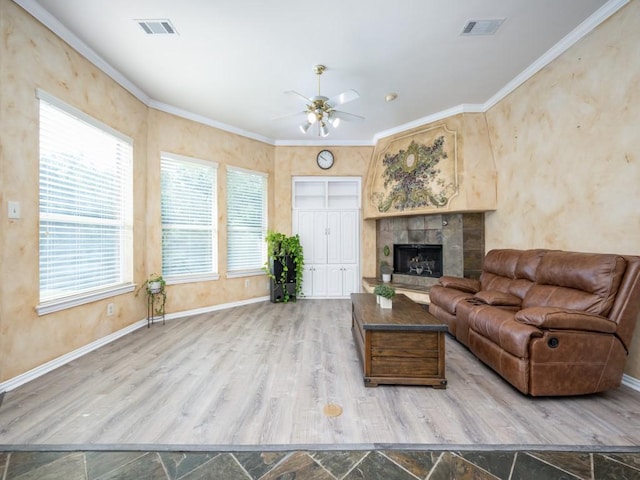 2302 Creek Crossing Dr, Corinth, TX 76210 - living room with ceiling fan, baseboards, a fireplace, wood finished floors, and ornamental molding