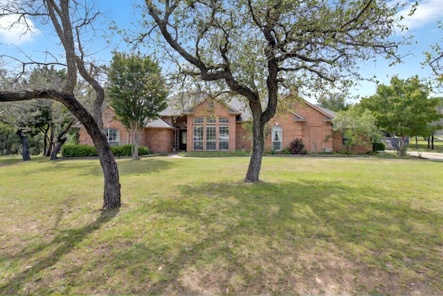 213 W Rio Rdg, Azle, TX 76020 - view of front of home featuring a front lawn and brick siding