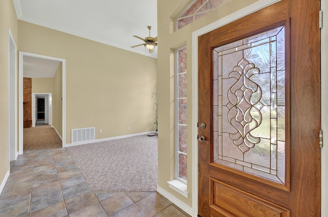 213 W Rio Rdg, Azle, TX 76020 - carpeted entryway with ceiling fan, tile patterned floors, baseboards, and crown molding