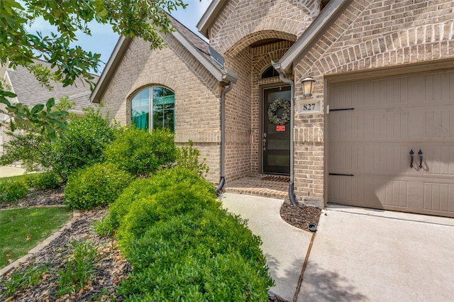 827 Esk Ave, Celina, TX 75009 - view of exterior entry featuring brick siding and an attached garage