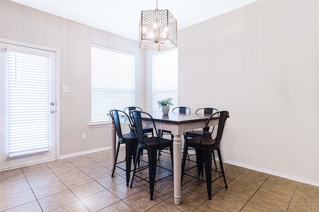 9908 Summer Sweet Dr, Mckinney, TX 75072 - tiled dining area with a chandelier and baseboards