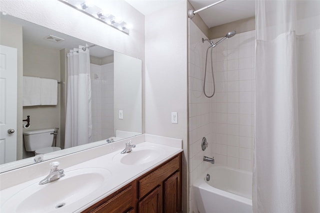 9908 Summer Sweet Dr, Mckinney, TX 75072 - bathroom featuring toilet, shower / tub combo with curtain, and double vanity