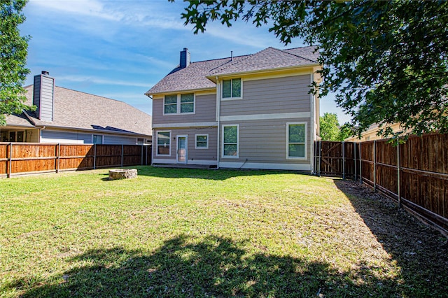 9908 Summer Sweet Dr, Mckinney, TX 75072 - rear view of house featuring a fire pit and a chimney