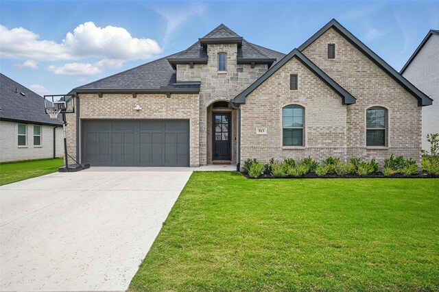 513 Fieldstone Ln, Haslet, TX 76052 - french provincial home featuring a front lawn, a garage, concrete driveway, brick siding, and a shingled roof