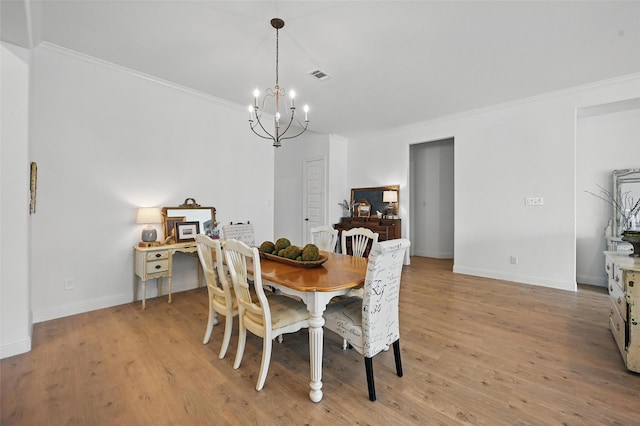 513 Fieldstone Ln, Haslet, TX 76052 - dining room with a chandelier, ornamental molding, baseboards, and light wood finished floors