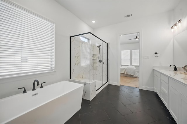 513 Fieldstone Ln, Haslet, TX 76052 - ensuite bathroom with a marble finish shower, healthy amount of natural light, a soaking tub, a ceiling fan, and recessed lighting