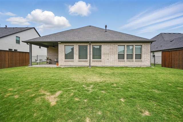 513 Fieldstone Ln, Haslet, TX 76052 - rear view of house with a patio area, brick siding, a shingled roof, and ceiling fan