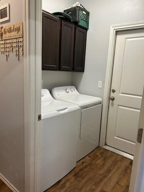 415 Magnolia, Hico, TX 76457 - clothes washing area with washer and dryer, cabinet space, and dark wood-style floors