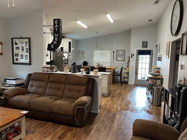 415 Magnolia, Hico, TX 76457 - living area with wood finished floors and high vaulted ceiling