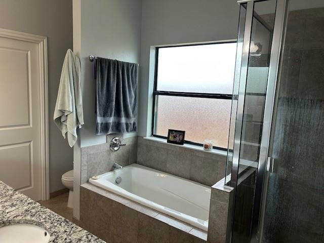 415 Magnolia, Hico, TX 76457 - full bathroom with a shower stall, a bath, toilet, and vanity