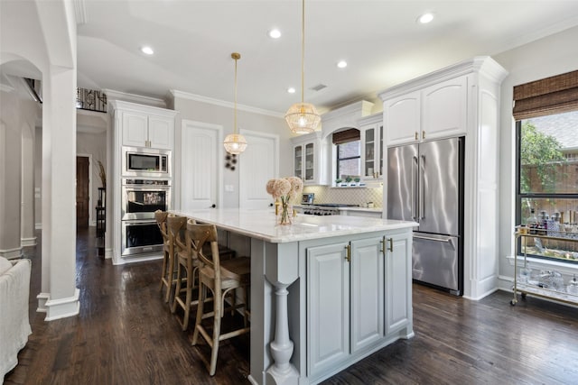 11353 Seaside Ln, Frisco, TX 75035 - kitchen featuring stainless steel appliances, glass insert cabinets, decorative backsplash, white cabinetry, and a kitchen island