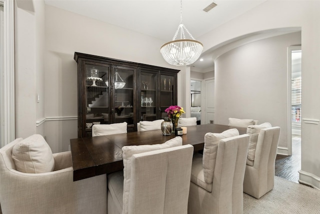 11353 Seaside Ln, Frisco, TX 75035 - dining space with a chandelier and arched walkways