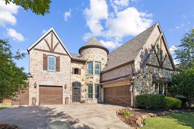 11353 Seaside Ln, Frisco, TX 75035 - view of front of property featuring stone siding, driveway, and a garage