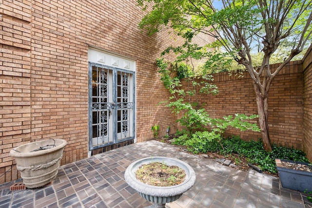 301 Peachtree St, Fairfield, TX 75840 - view of patio with french doors and fence