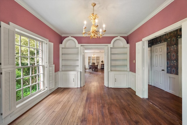 301 Peachtree St, Fairfield, TX 75840 - unfurnished dining area with a chandelier, crown molding, healthy amount of natural light, dark wood-type flooring, and wainscoting