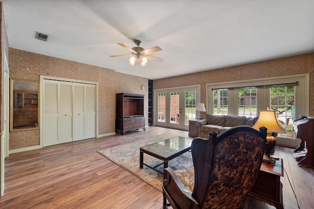 301 Peachtree St, Fairfield, TX 75840 - living area featuring french doors, plenty of natural light, ceiling fan, and light wood-style floors