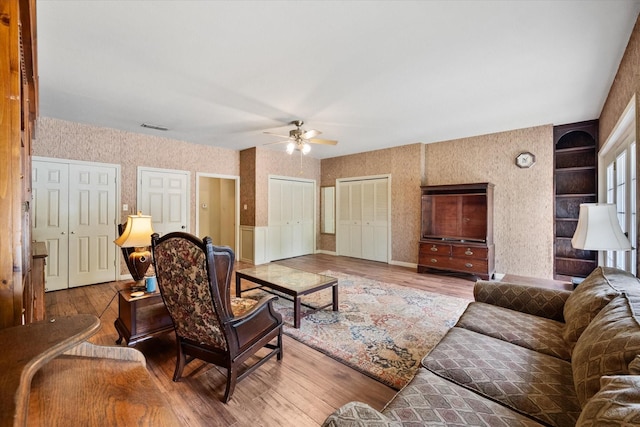 301 Peachtree St, Fairfield, TX 75840 - living room featuring wallpapered walls, wood finished floors, and ceiling fan