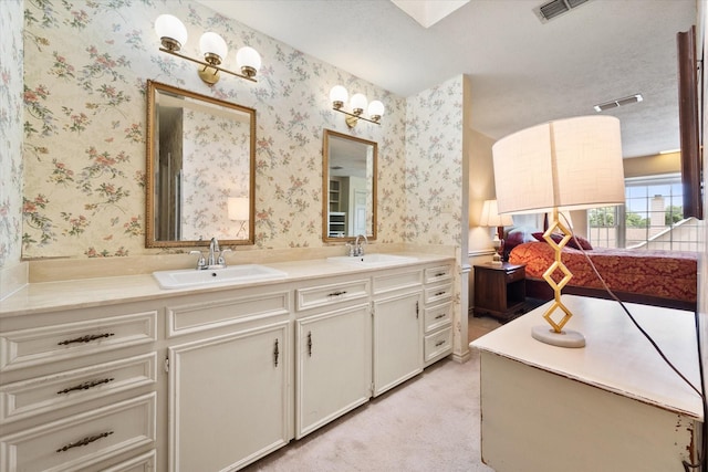 301 Peachtree St, Fairfield, TX 75840 - full bathroom with wallpapered walls and double vanity