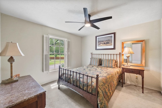301 Peachtree St, Fairfield, TX 75840 - bedroom featuring light carpet, baseboards, and a ceiling fan