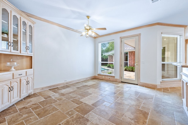 3441 Mount Vernon Way, Plano, TX 75025 - unfurnished dining area with stone tile floors, baseboards, ceiling fan, and crown molding