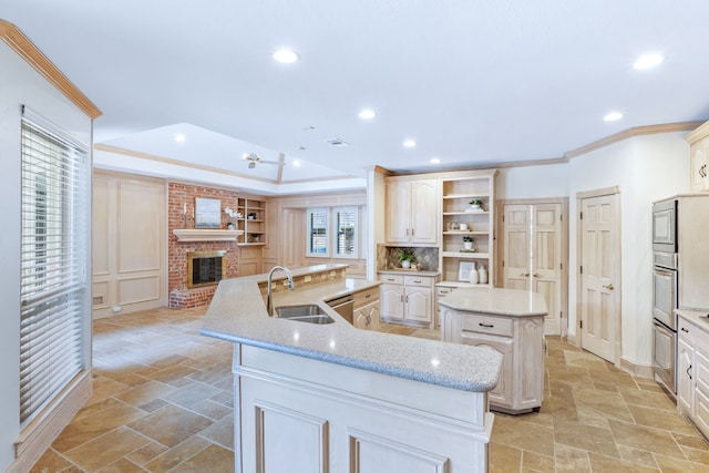 3441 Mount Vernon Way, Plano, TX 75025 - kitchen featuring a spacious island, a sink, stone tile floors, crown molding, and recessed lighting