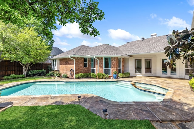 3441 Mount Vernon Way, Plano, TX 75025 - view of swimming pool featuring fence, a patio area, and a pool with connected hot tub