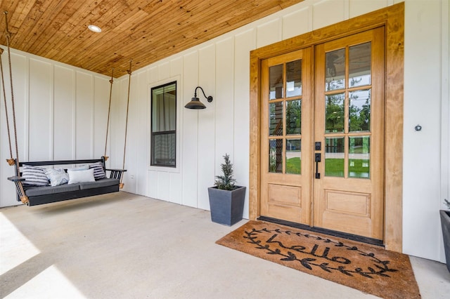 205 Oak Creek Dr, Tool, TX 75143 - property entrance with french doors and board and batten siding