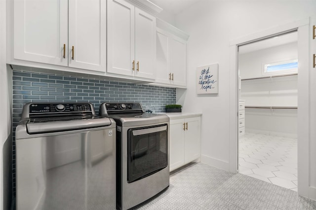 205 Oak Creek Dr, Tool, TX 75143 - washroom featuring washing machine and clothes dryer, cabinet space, and baseboards