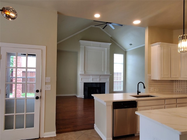 3725 Hibbs St, Plano, TX 75025 - kitchen featuring stainless steel dishwasher, a sink, a ceiling fan, a high end fireplace, and lofted ceiling