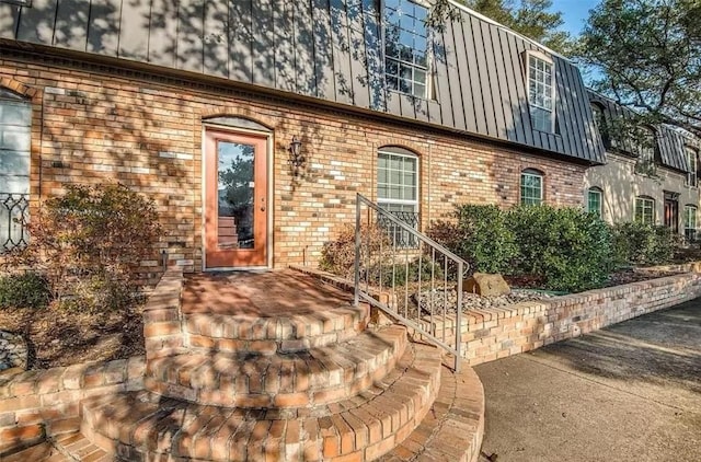 5232 Fleetwood Oaks Ave Unit 216, Dallas, TX 75235 - view of exterior entry with brick siding and mansard roof