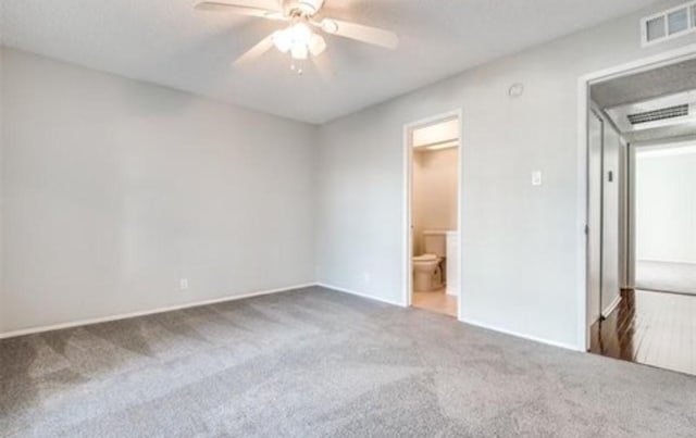 5232 Fleetwood Oaks Ave Unit 216, Dallas, TX 75235 - unfurnished bedroom with carpet flooring, baseboards, a ceiling fan, and ensuite bath
