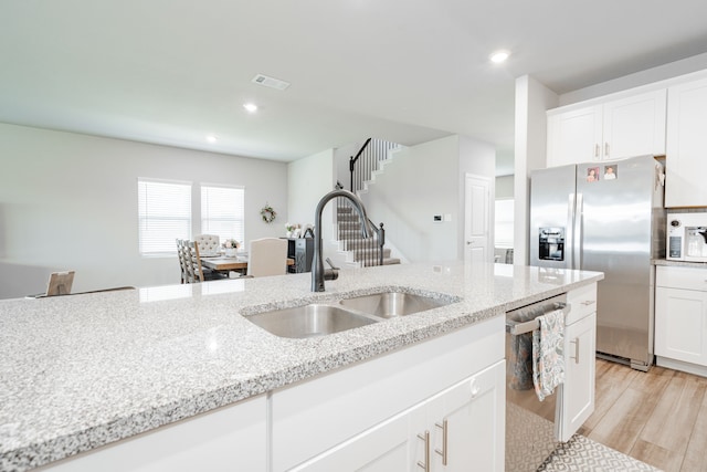 333 Mohan Dr, Royse City, TX 75189 - kitchen featuring a sink, stainless steel appliances, light stone countertops, white cabinets, and recessed lighting