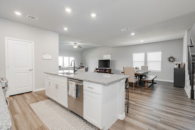 333 Mohan Dr, Royse City, TX 75189 - kitchen featuring dishwasher, a sink, light wood finished floors, white cabinets, and an island with sink