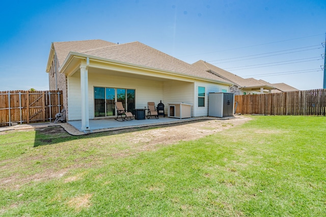 333 Mohan Dr, Royse City, TX 75189 - rear view of house featuring a patio, roof with shingles, and a storage unit