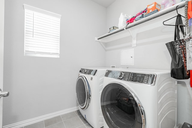 333 Mohan Dr, Royse City, TX 75189 - washroom with washer and dryer, baseboards, and light tile patterned floors