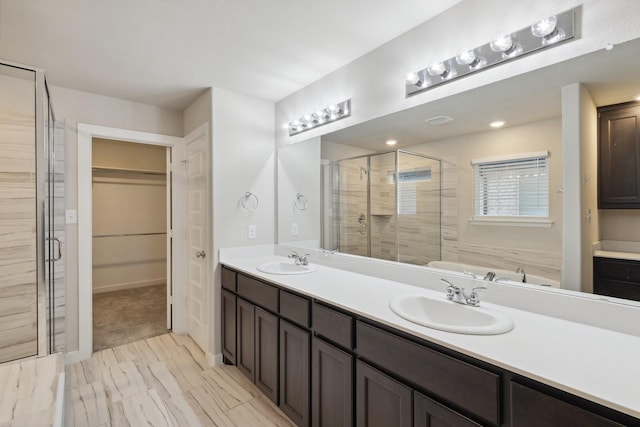 3537 W Cheney Ave, Celina, TX 75009 - full bathroom with a shower stall, double vanity, and a spacious closet
