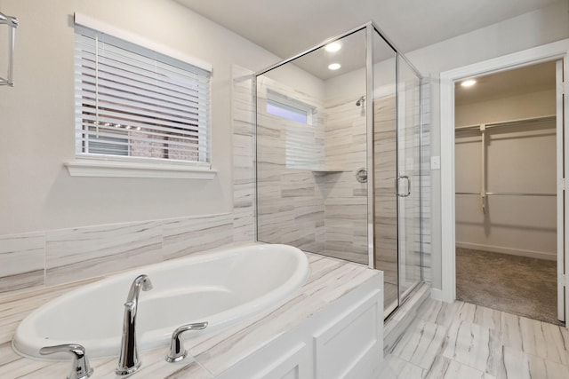 3537 W Cheney Ave, Celina, TX 75009 - full bathroom featuring a stall shower, a garden tub, a spacious closet, and recessed lighting