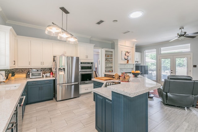 1220 Mount Gilead Rd, Keller, TX 76262 - kitchen featuring appliances with stainless steel finishes, open floor plan, tasteful backsplash, crown molding, and a sink