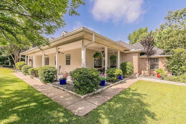 1220 Mount Gilead Rd, Keller, TX 76262 - view of front facade with ceiling fan, a front lawn, and brick siding
