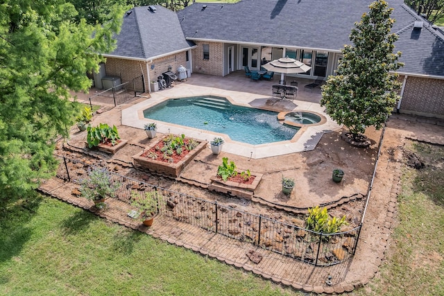1220 Mount Gilead Rd, Keller, TX 76262 - view of swimming pool with a patio, a pool with connected hot tub, and a vegetable garden
