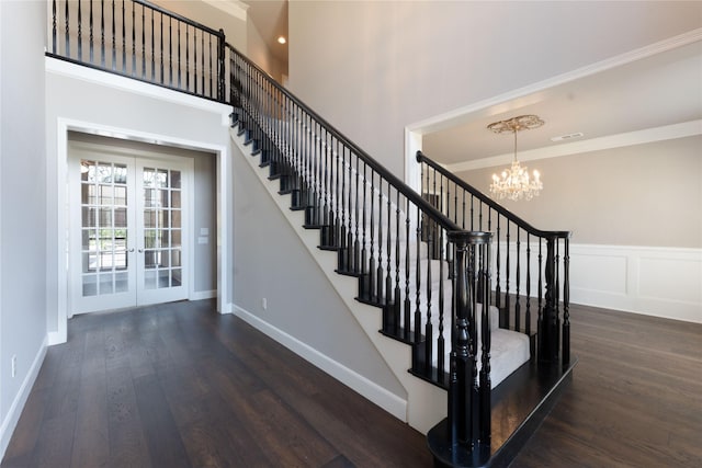 209 Timber Lake Dr, Southlake, TX 76092 - stairway with french doors, wood finished floors, a chandelier, crown molding, and baseboards