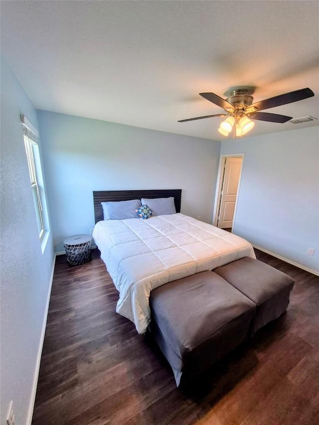 2415 Russell St, Crandall, TX 75114 - bedroom with dark wood-type flooring, baseboards, and ceiling fan