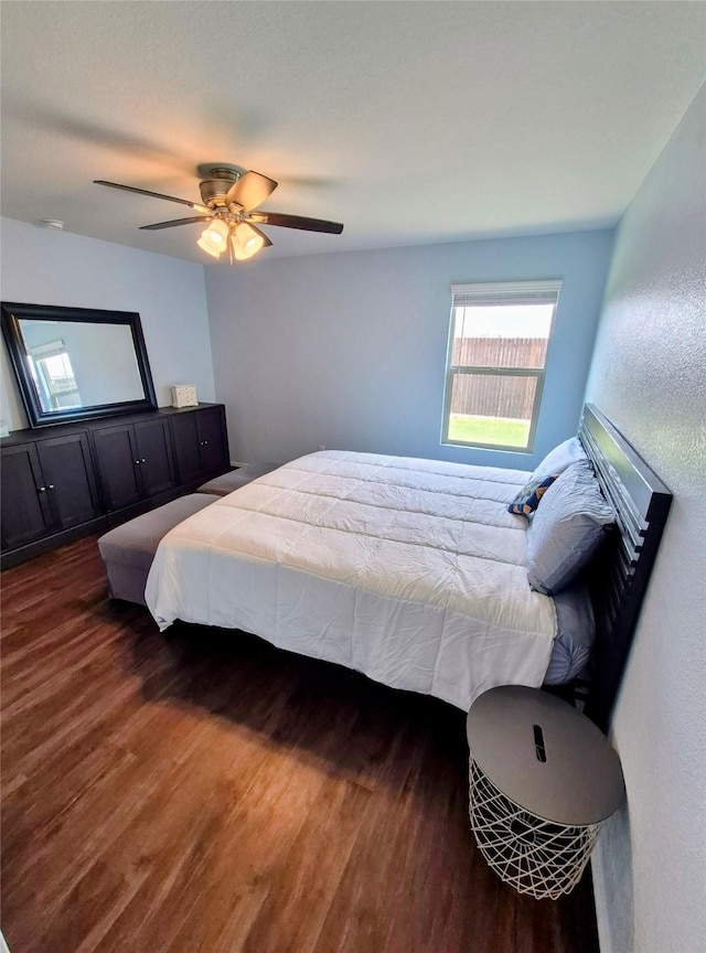 2415 Russell St, Crandall, TX 75114 - bedroom featuring multiple windows, wood finished floors, and a ceiling fan