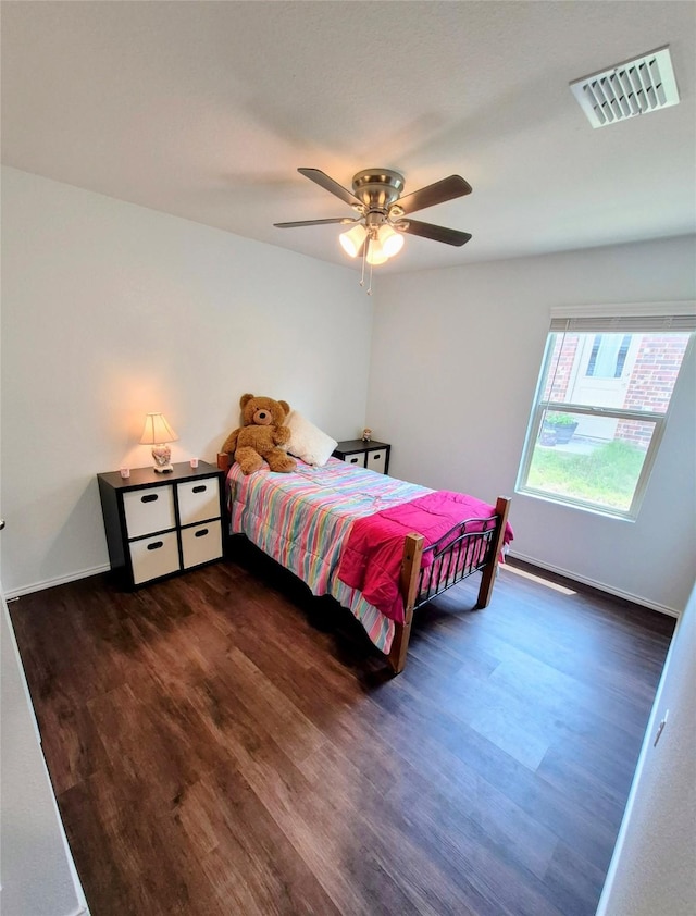 2415 Russell St, Crandall, TX 75114 - bedroom with wood finished floors, ceiling fan, and baseboards