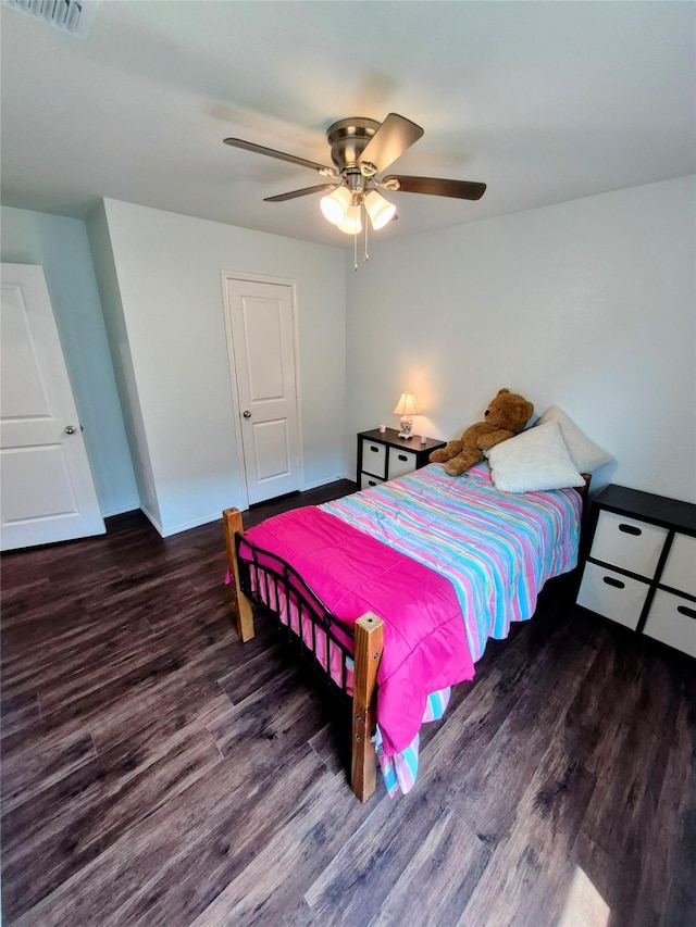 2415 Russell St, Crandall, TX 75114 - bedroom featuring wood finished floors and a ceiling fan
