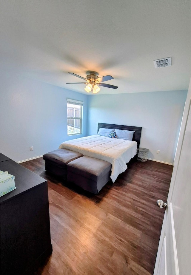 2415 Russell St, Crandall, TX 75114 - bedroom with wood finished floors, baseboards, and ceiling fan