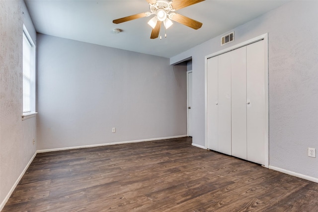 4833 Harper Dr, Mesquite, TX 75150 - unfurnished bedroom featuring multiple windows, wood finished floors, baseboards, and a ceiling fan