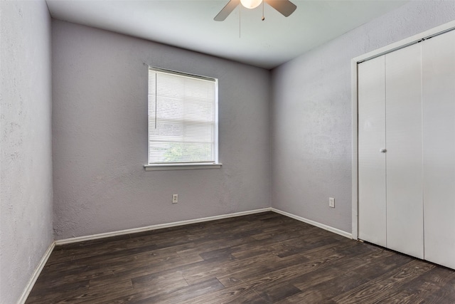 4833 Harper Dr, Mesquite, TX 75150 - unfurnished bedroom featuring wood finished floors, a closet, baseboards, a ceiling fan, and a textured wall